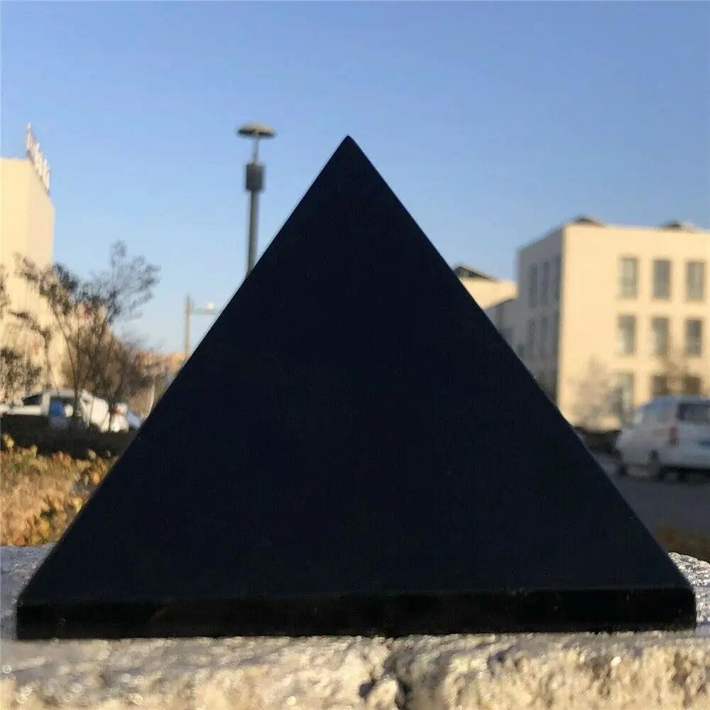 Black Tourmaline Crystal Carved Protection Pyramid, a sleek, dark pyramid for grounding and energetic protection.