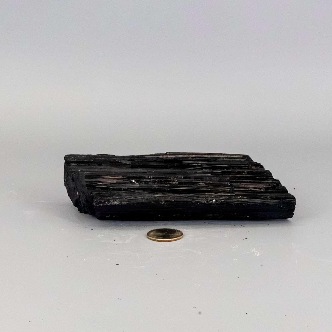 Black Tourmaline Crystal Raw Hunk Elongated Specimen, a powerful, striated black crystal for grounding and protection.