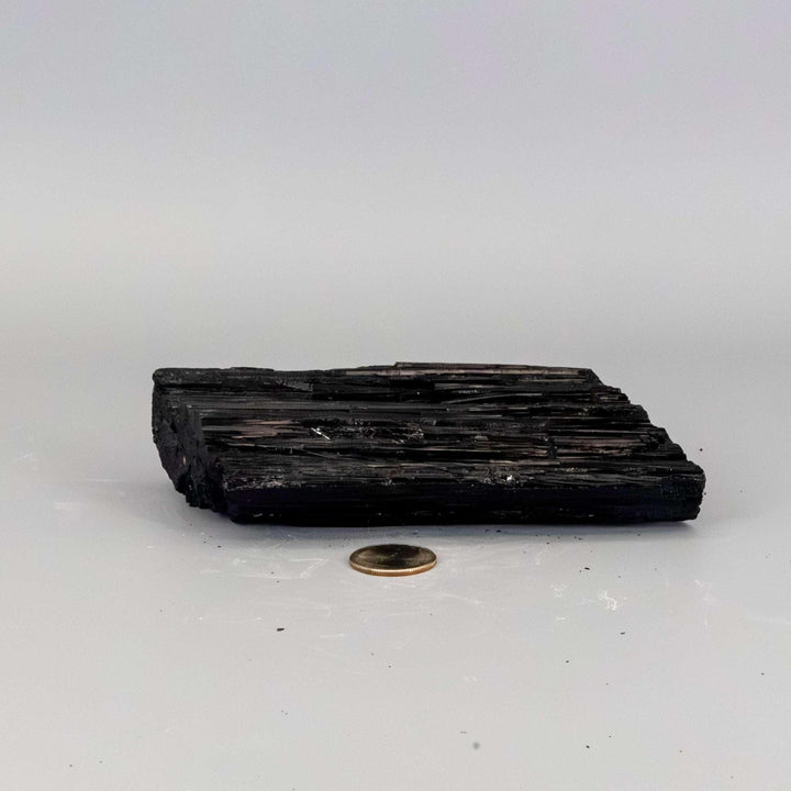 Black Tourmaline Crystal Raw Hunk Elongated Specimen, a powerful, striated black crystal for grounding and protection.