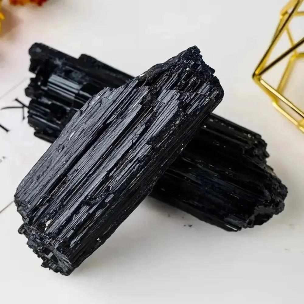 Large raw black tourmaline stone with natural vertical striations, perfect for healing energy and home decor.