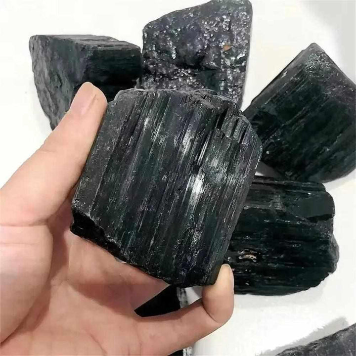 Large raw black tourmaline stone with natural striated texture, perfect for grounding, healing, and home decor.