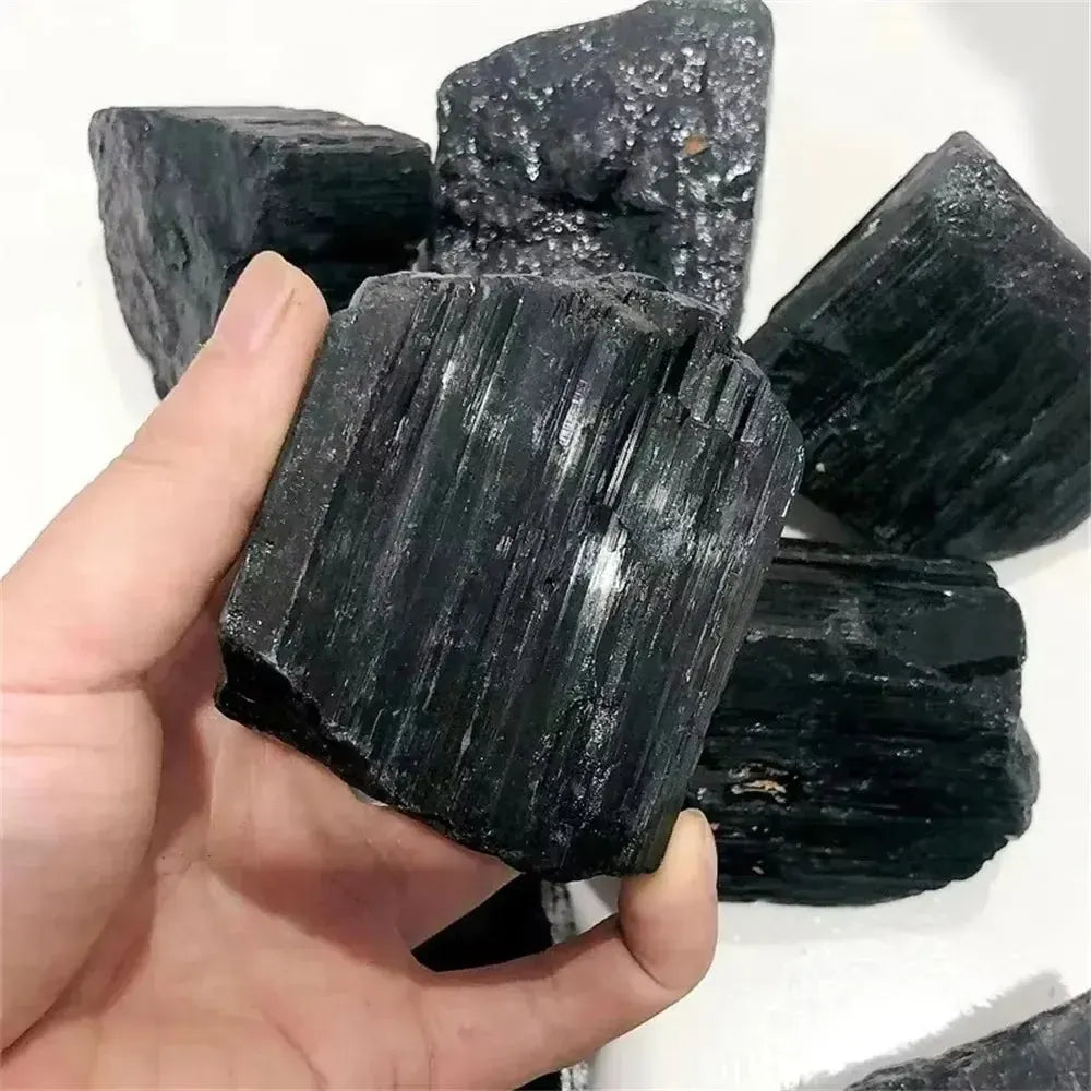 Large raw black tourmaline stone with natural striated texture, perfect for grounding, healing, and home decor.