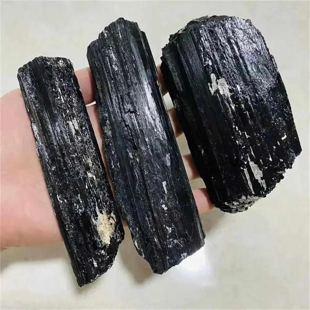 Large raw black tourmaline stones with natural, unpolished textures perfect for healing and home decor.