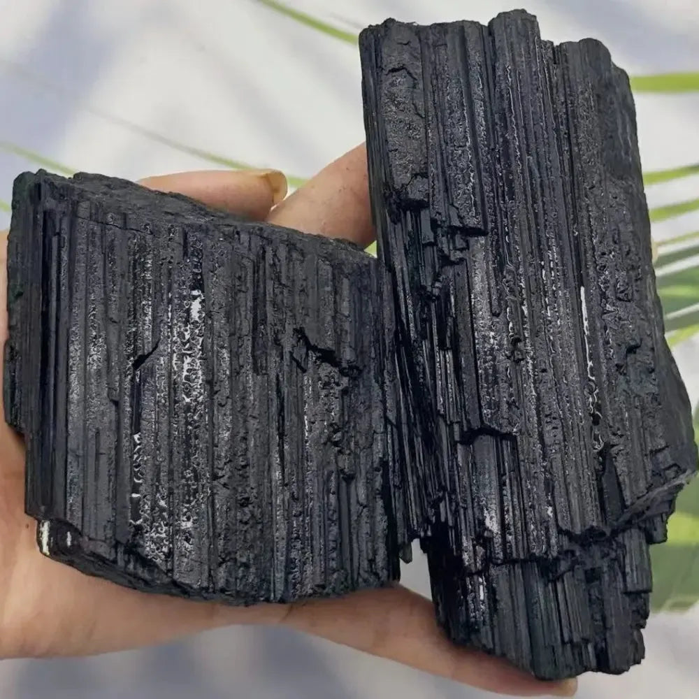 Large raw black tourmaline stone with natural vertical striations, perfect for grounding, healing, and home decor.