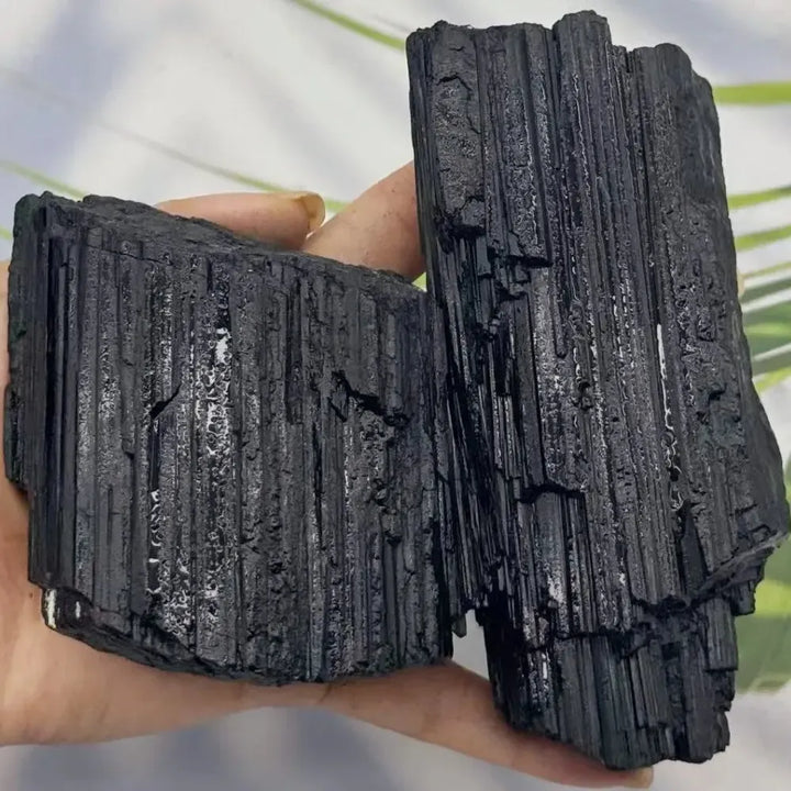 Large raw black tourmaline stone with natural vertical striations, perfect for grounding, healing, and home decor.