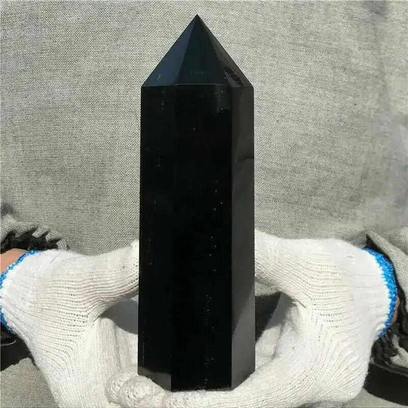 Glossy Black Tourmaline tower with a faceted point, perfect for grounding and protection in your meditation space.