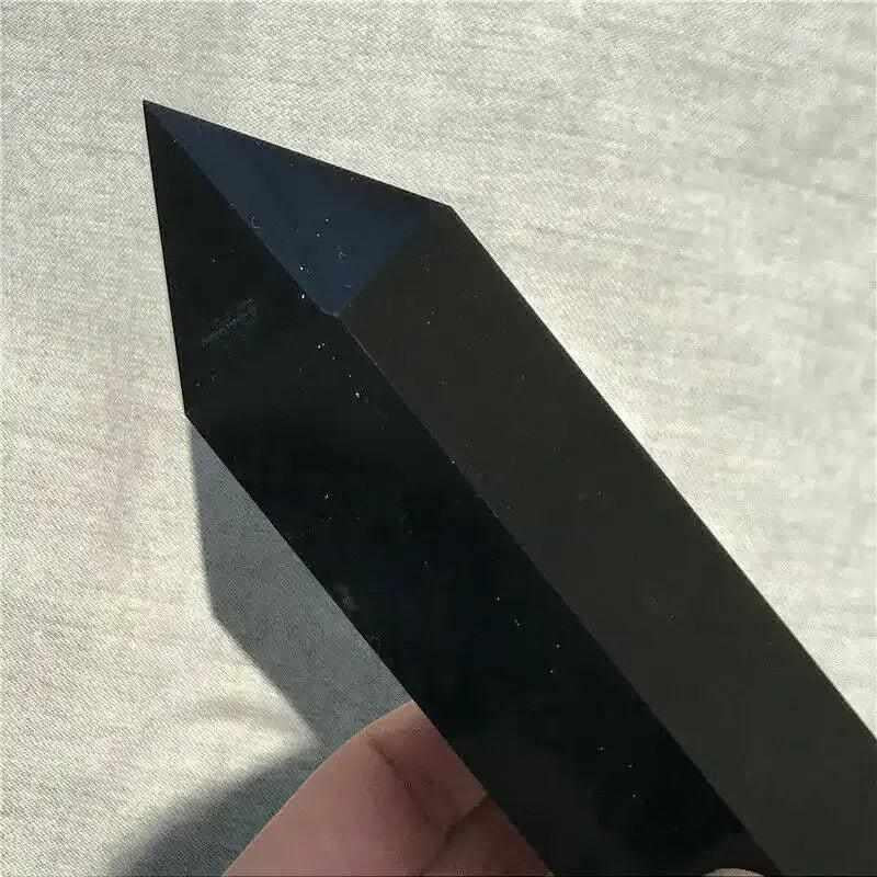 Glossy Black Tourmaline tower with a faceted point, perfect for grounding, protection, and Root chakra energy.