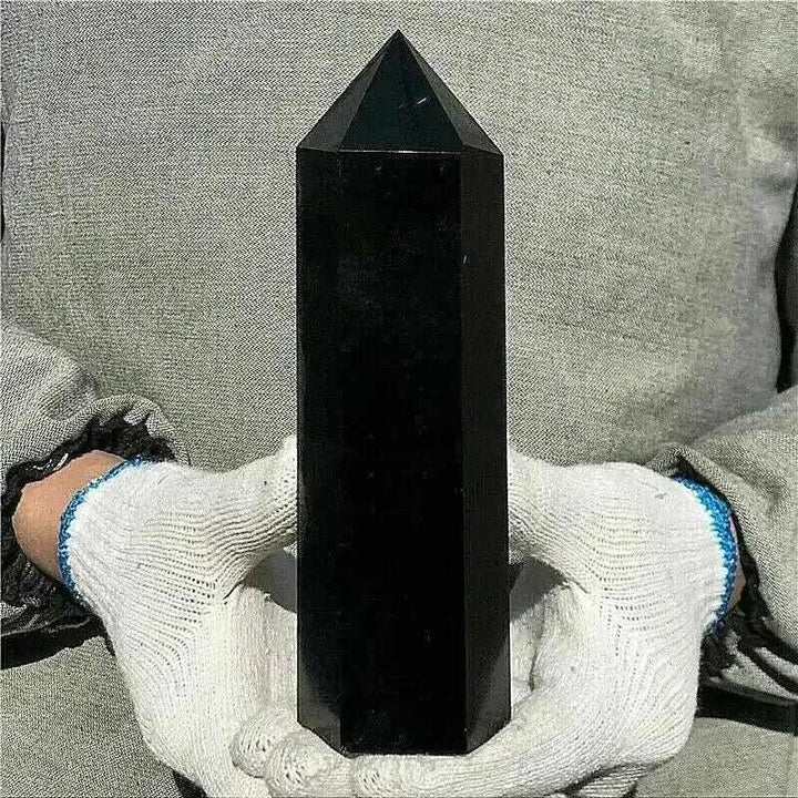 Glossy Black Tourmaline tower with a faceted point, perfect for grounding and protection in your meditation space.
