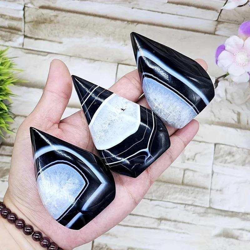 Three polished Black and White Agate Crystal Torches, showcasing stark black banding and clean white.