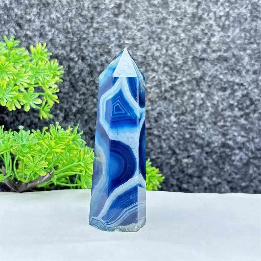 Polished blue agate hexagonal tower with soothing blue banding, perfect for Throat Chakra healing and calm communication.