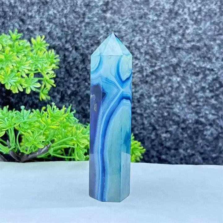 Polished blue agate hexagonal tower with soothing blue banding, perfect for Throat Chakra healing and calm focus.