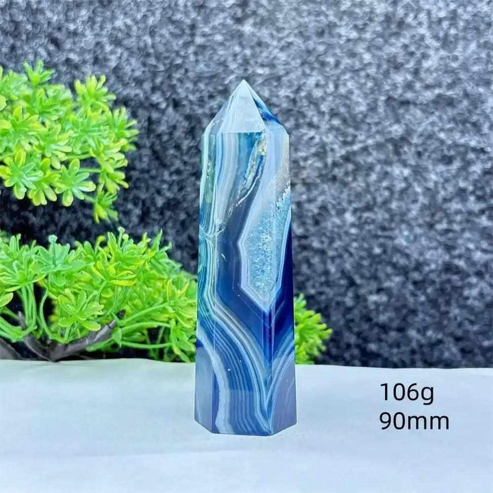 Polished blue agate hexagonal tower with soothing blue banding, perfect for throat chakra healing and calm communication.