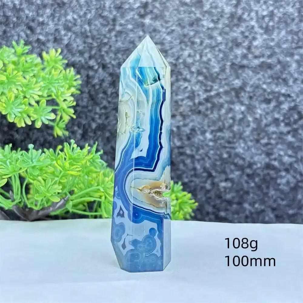 Polished blue agate hexagonal tower with soothing blue banding, perfect for throat chakra healing and calm focus.