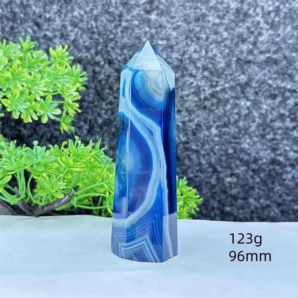 Polished blue agate hexagonal tower with soothing blue banding, perfect for throat chakra healing and calm communication.
