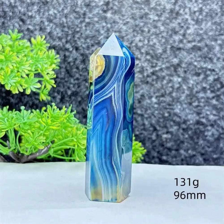 Polished blue agate hexagonal tower with soothing blue banding, perfect for Throat Chakra healing and calm focus.