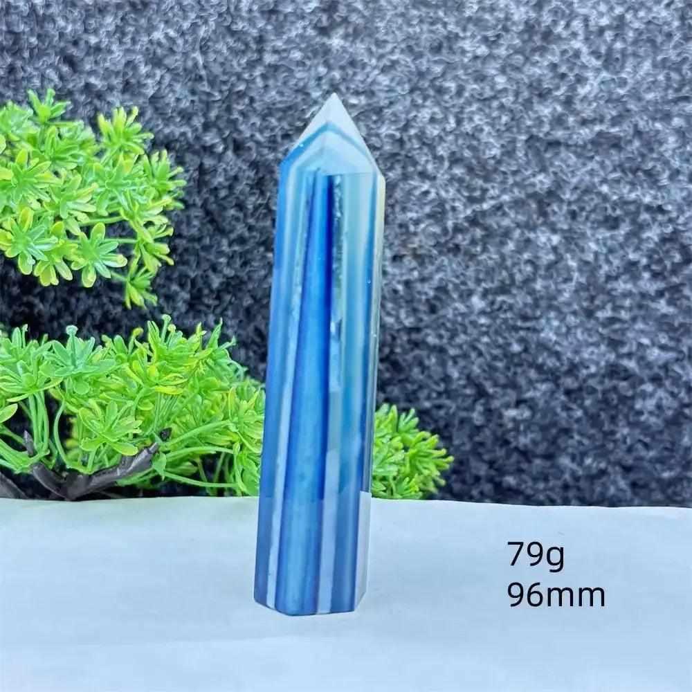 Polished blue agate hexagonal tower with soft blue banding, perfect for throat chakra healing and calming desk decor.