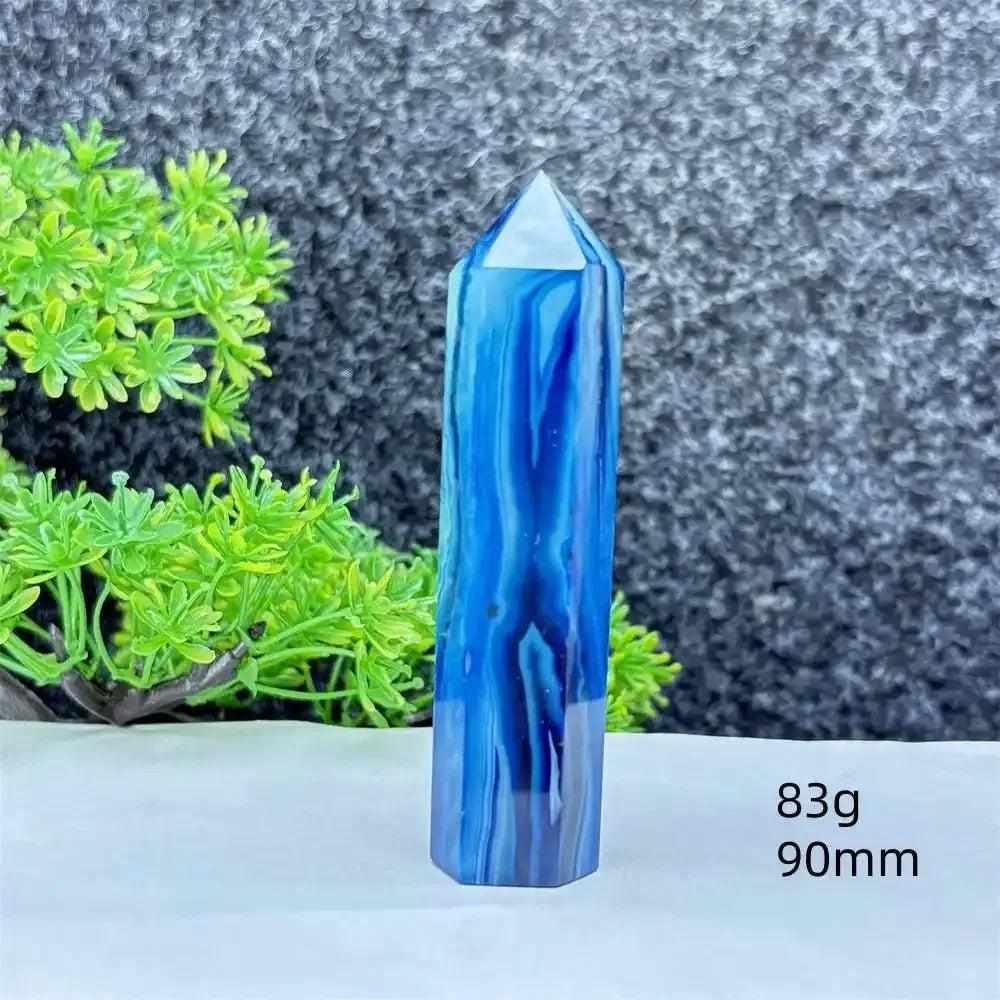 Polished blue agate hexagonal tower with soothing blue banding, perfect for Throat Chakra healing and desk decor.