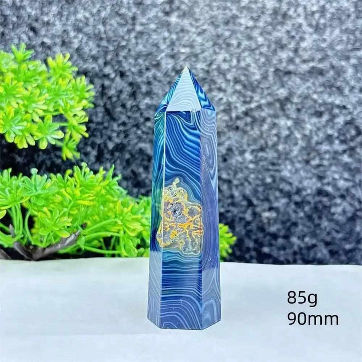 Polished blue agate hexagonal tower with soothing blue banding, perfect for Throat Chakra healing and calm focus.