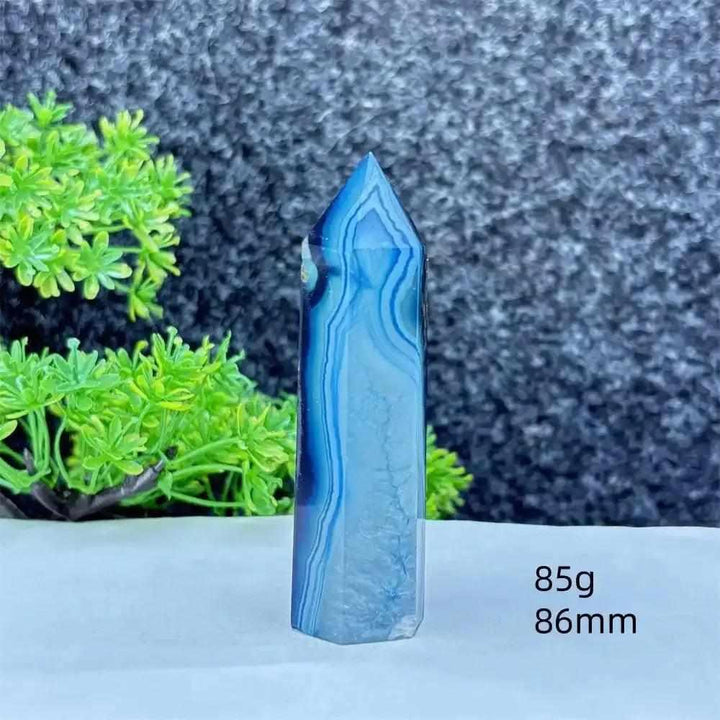 Polished blue agate hexagonal tower with soothing blue banding, perfect for throat chakra healing and calm focus.