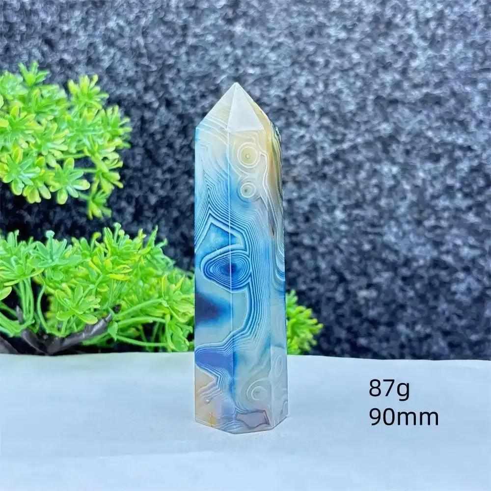 Polished blue agate hexagonal tower with soft blue banding, perfect for Throat Chakra healing and calm, focused energy.