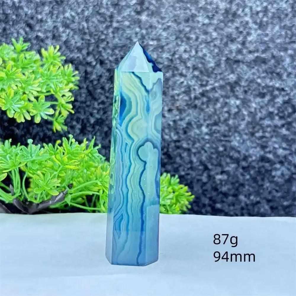 Polished blue agate hexagonal tower with soothing blue banding, perfect for Throat Chakra healing and calm focus.