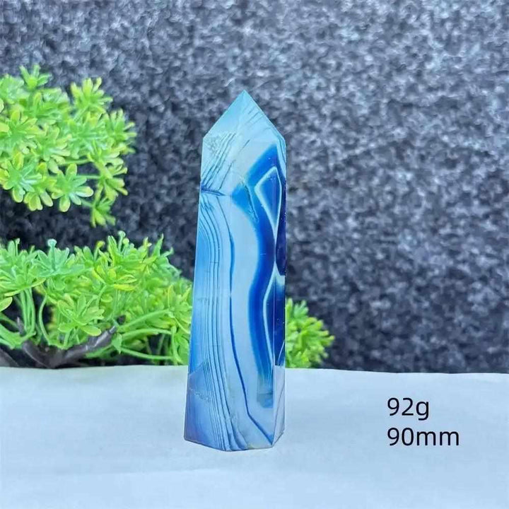 Polished blue agate hexagonal tower with soothing blue banding, perfect for Throat Chakra healing and calm focus.