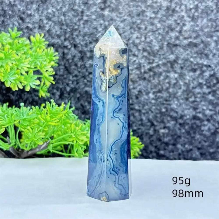 Polished blue agate hexagonal tower with soft blue banding, perfect for Throat Chakra healing and calming desk decor.