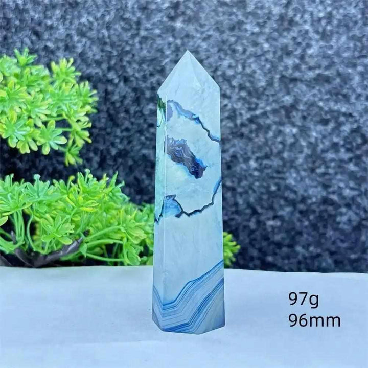 Polished blue agate hexagonal tower with soft blue banding, perfect for calming Throat Chakra energy and desk decor.