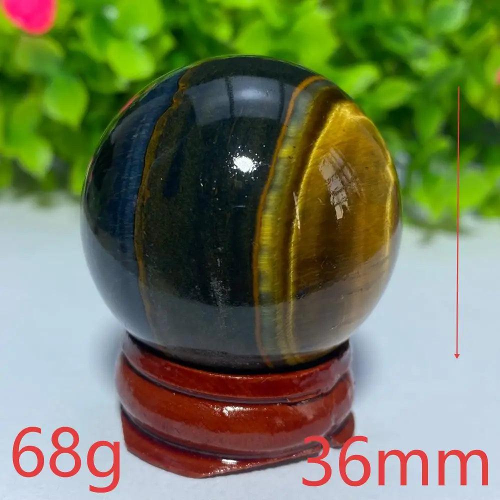 36mm natural blue and yellow Tiger Eye crystal ball for Reiki healing, meditation, and spiritual home decor.