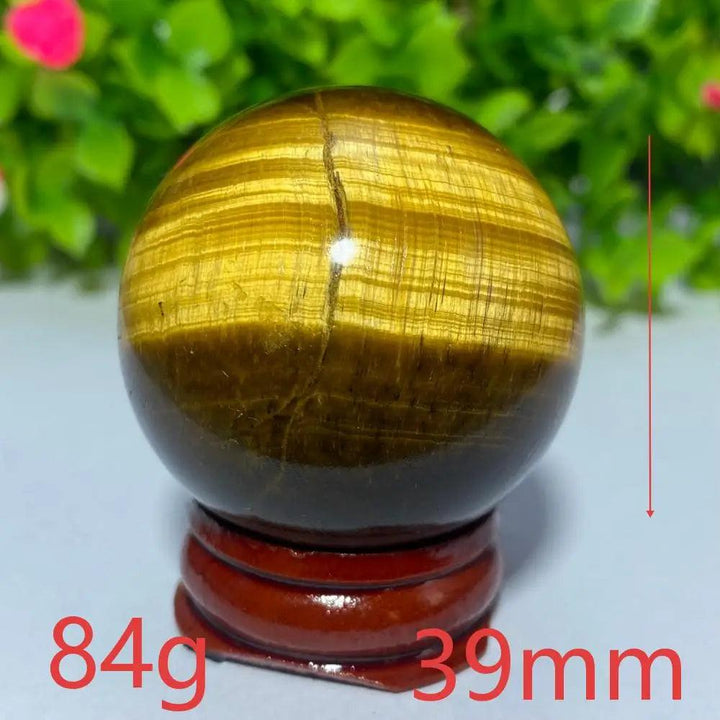39mm natural yellow Tiger Eye crystal ball for Reiki healing and meditation, featuring a polished, banded golden sphere.