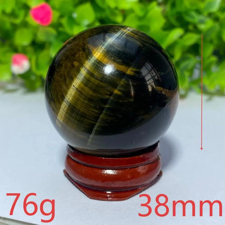 38mm natural blue and yellow Tiger Eye crystal ball on a wooden stand, perfect for Reiki healing and spiritual decor.