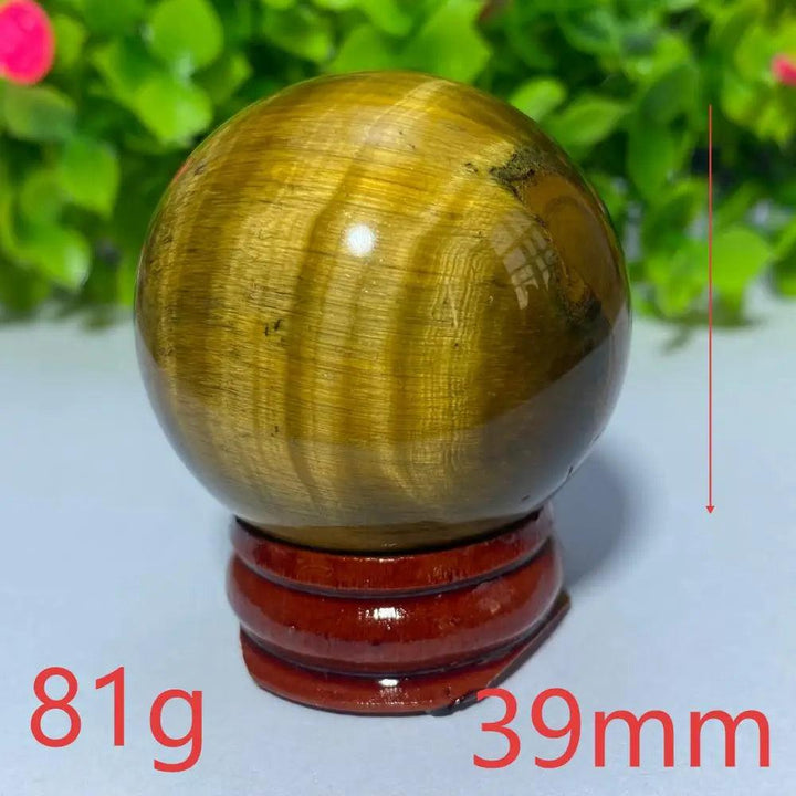 39mm natural yellow tiger eye crystal ball for Reiki healing and meditation, featuring a polished, golden-brown sphere.