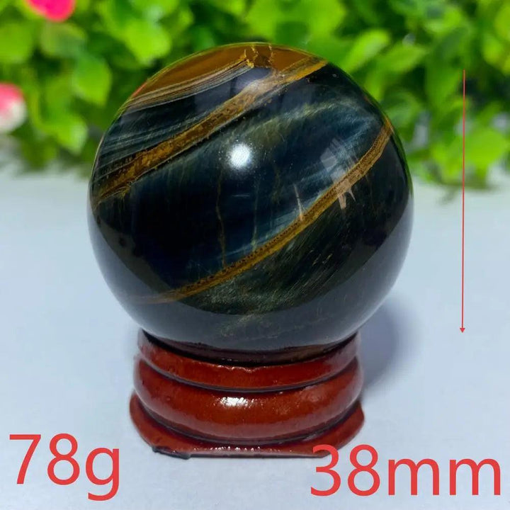 38mm Natural Blue and Yellow Tiger Eye crystal ball on a wooden stand, perfect for Reiki healing and spiritual decor.