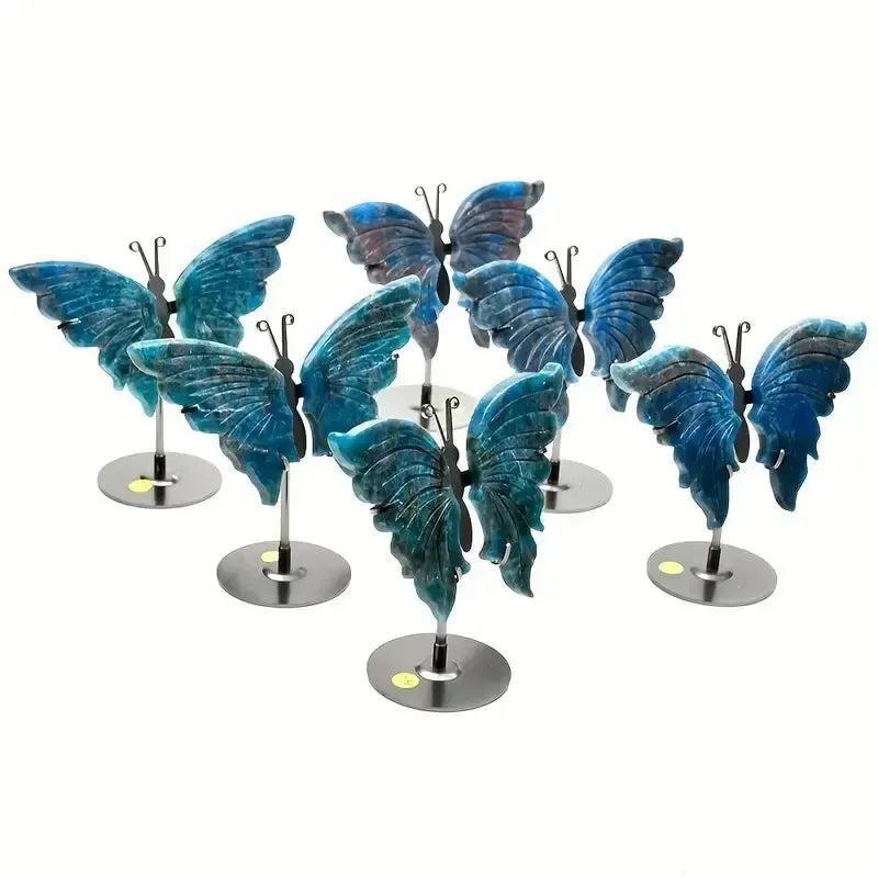 Vivid blue Apatite butterfly wings crystal carvings on stands, symbolizing transformation and clarity.