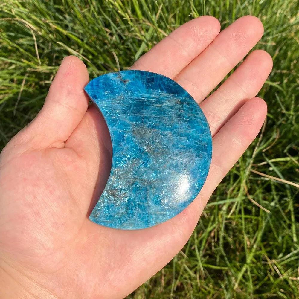 Hand-carved Blue Apatite crescent moon crystal with vibrant electric blue tones for focus, creativity, and clarity.
