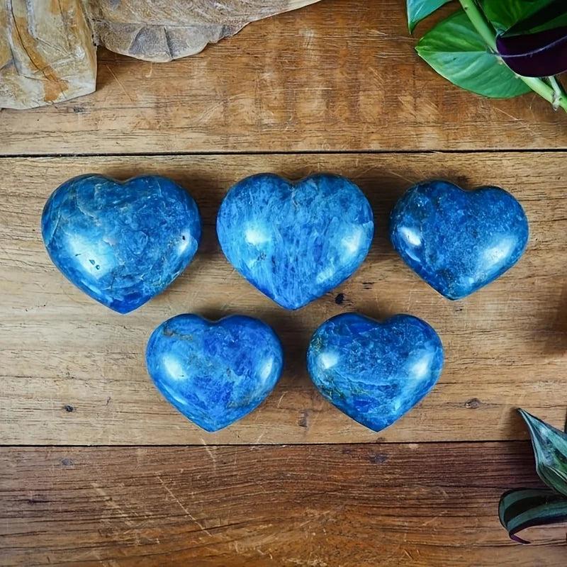 Five polished blue apatite crystal hearts with deep teal-cobalt hues, perfect for meditation and throat chakra healing.