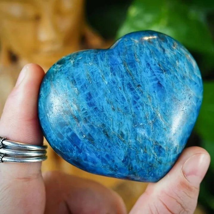 Polished blue apatite crystal heart with vivid blue-green tones, perfect for meditation and throat chakra healing.