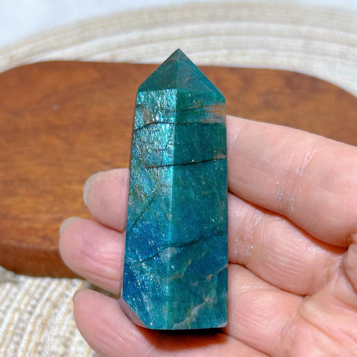 Natural blue flashy apatite crystal tower with shimmering mineral inclusions, perfect for Reiki healing and home decor.
