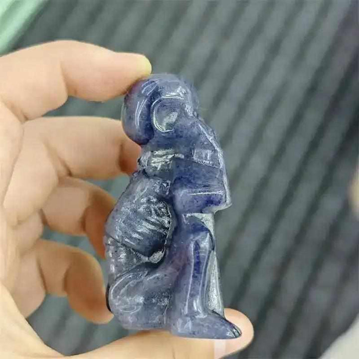 60mm Blue Aventurine skeleton carving with polished blue-gray stone, detailed rib cage, and Throat Chakra energy.