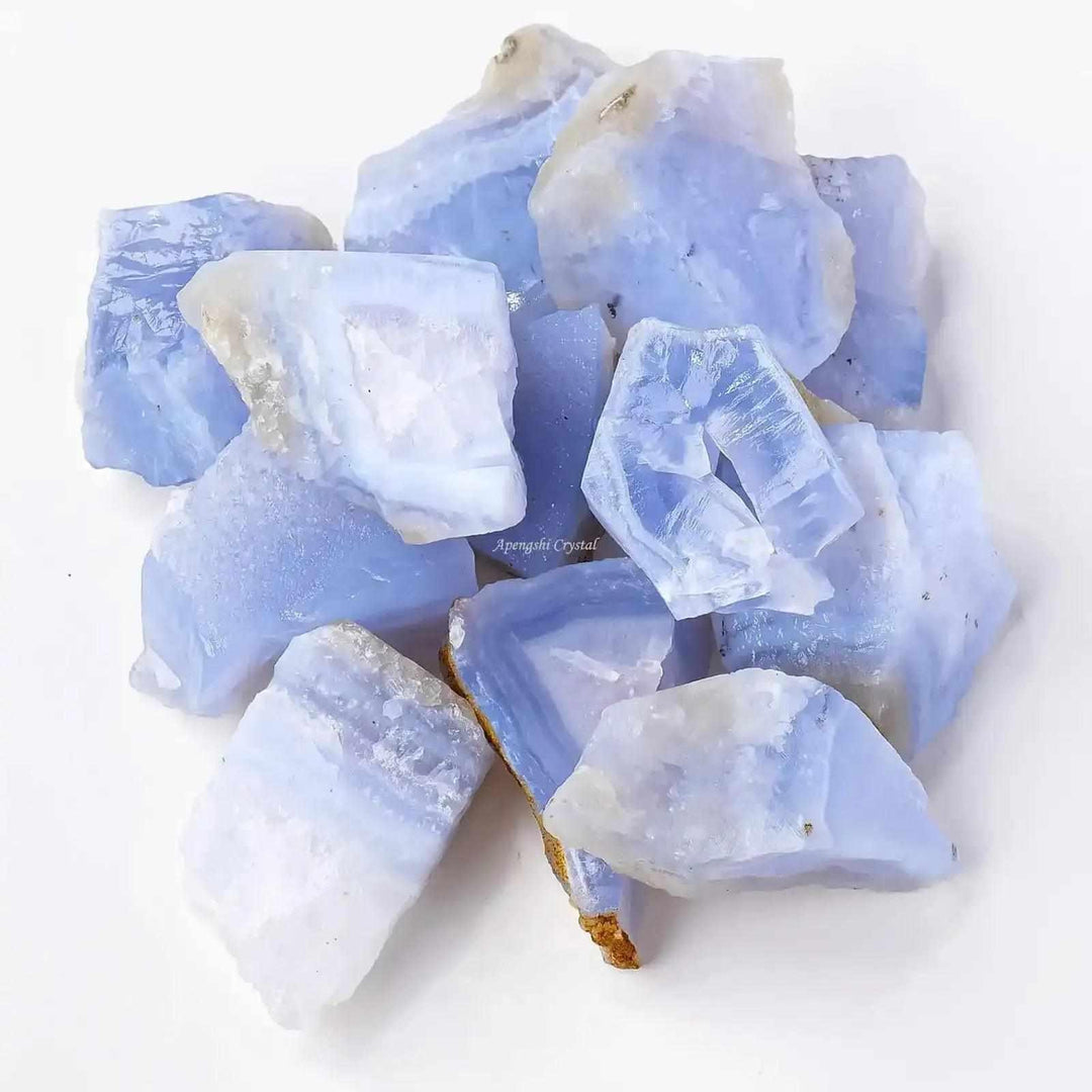 Raw blue banded agate chunks with calming blue and white layers, perfect for Throat chakra meditation and focus.