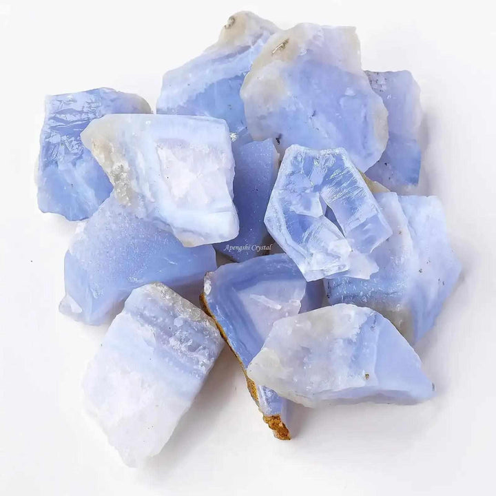 Raw blue banded agate chunks with calming blue and white layers, perfect for Throat chakra meditation and focus.