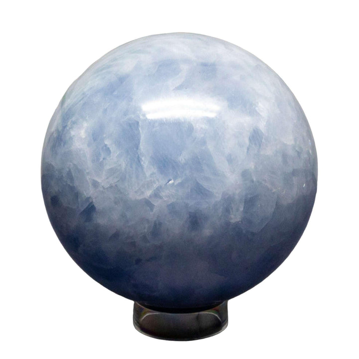 Calming Blue Calcite Sphere, 72-93mm, with hazy blue hues and a smooth, polished finish.