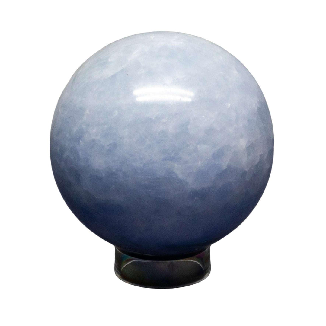 Calming Blue Calcite Sphere, a polished crystal ball with hazy blue hues, promoting tranquility.