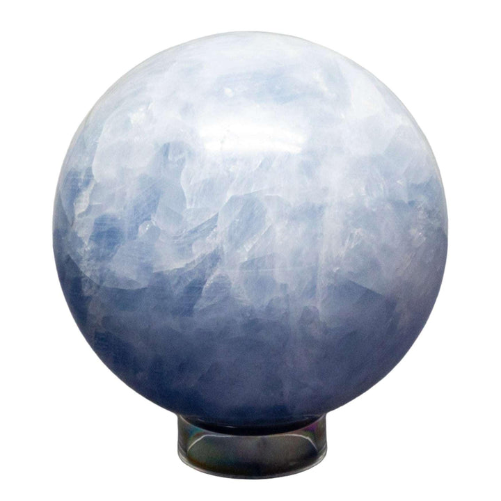 Calming Blue Calcite Sphere, 72-93mm, with hazy blue hues, polished to maximize translucency and color depth.