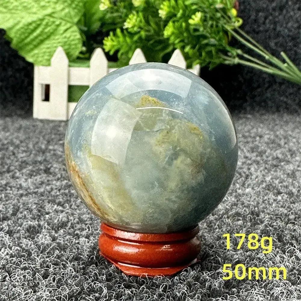 Blue Calcite Crystal Sphere: Stunning, hand-polished sphere with serene blue tones for emotional healing and stress relief.