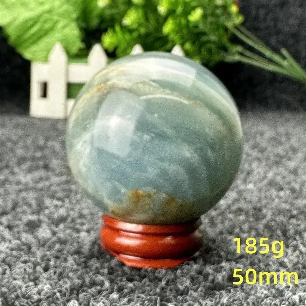 Blue Calcite Crystal Sphere, a stunning, hand-polished sphere with serene blue tones for peace and emotional healing.