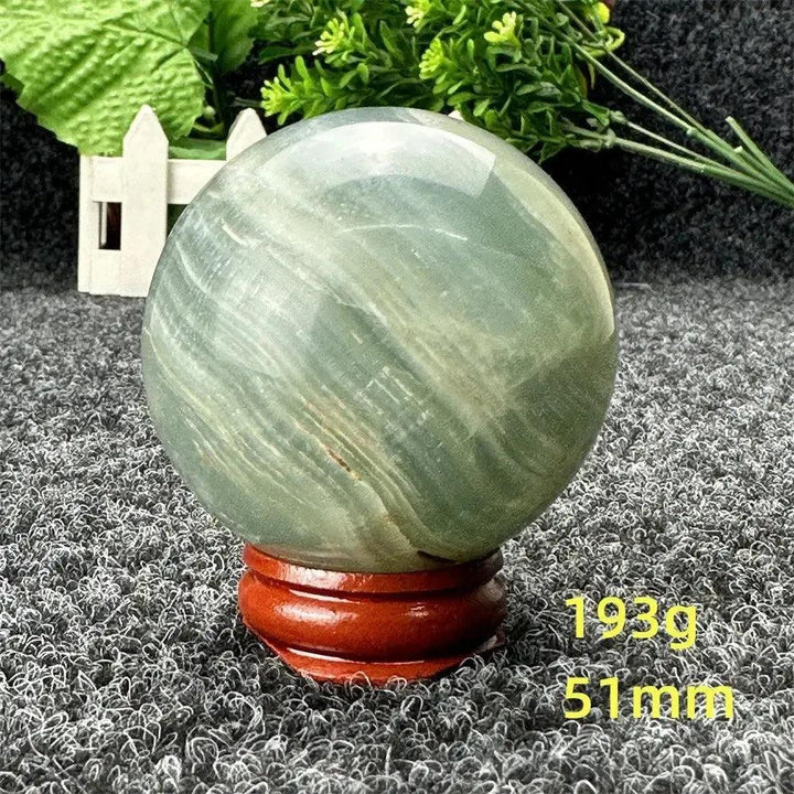 Stunning Blue Calcite Crystal Sphere, 51mm, 193g, with serene blue tones, promoting peace and emotional healing.