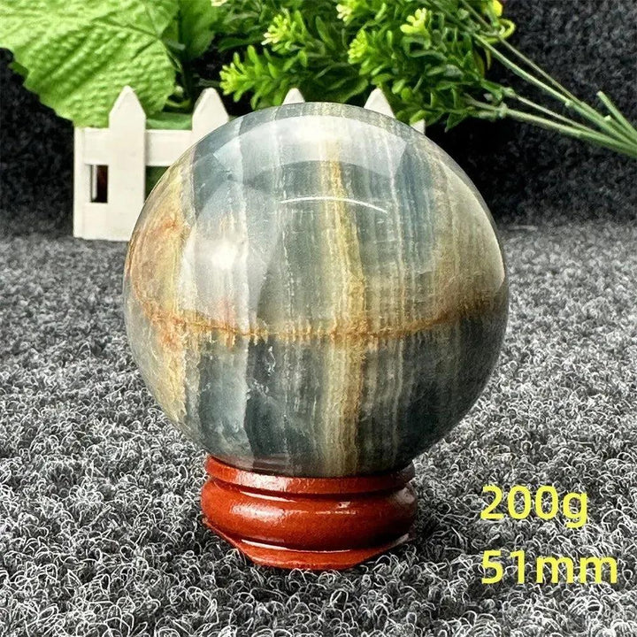 Stunning Blue Calcite Crystal Sphere, 51mm, 200g, with serene blue and brown tones for emotional healing and peace.