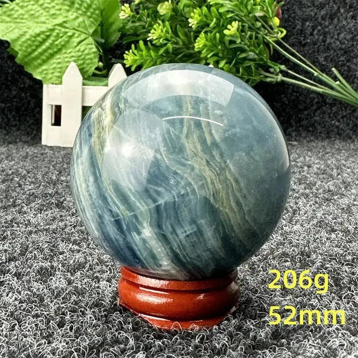 Stunning Blue Calcite Crystal Sphere with serene blue tones, hand-polished for relaxation and emotional healing.
