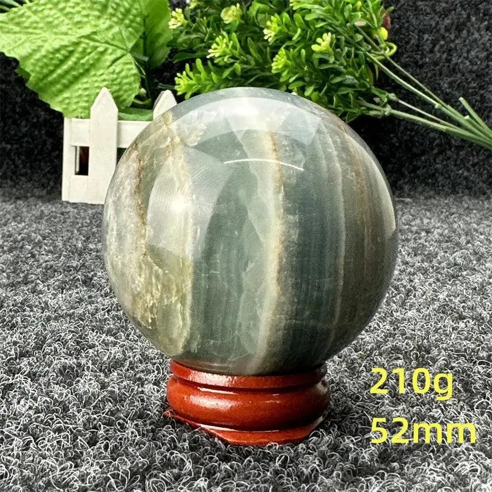 Stunning Blue Calcite Crystal Sphere, 52mm, 210g, showcasing serene blue tones for peace and emotional healing.